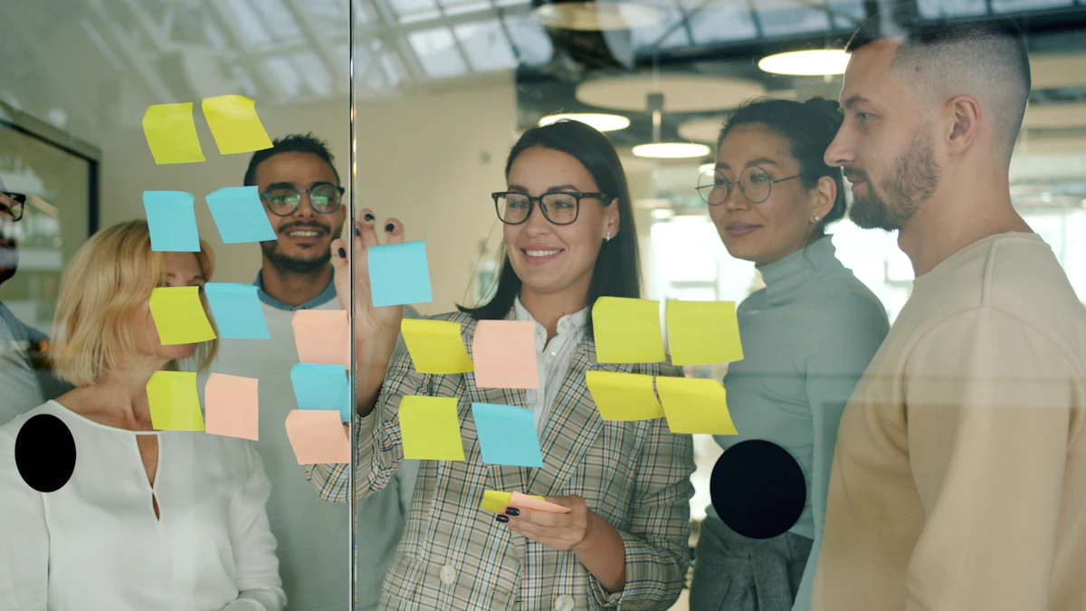 A team arranging sticky notes on a glass wall.